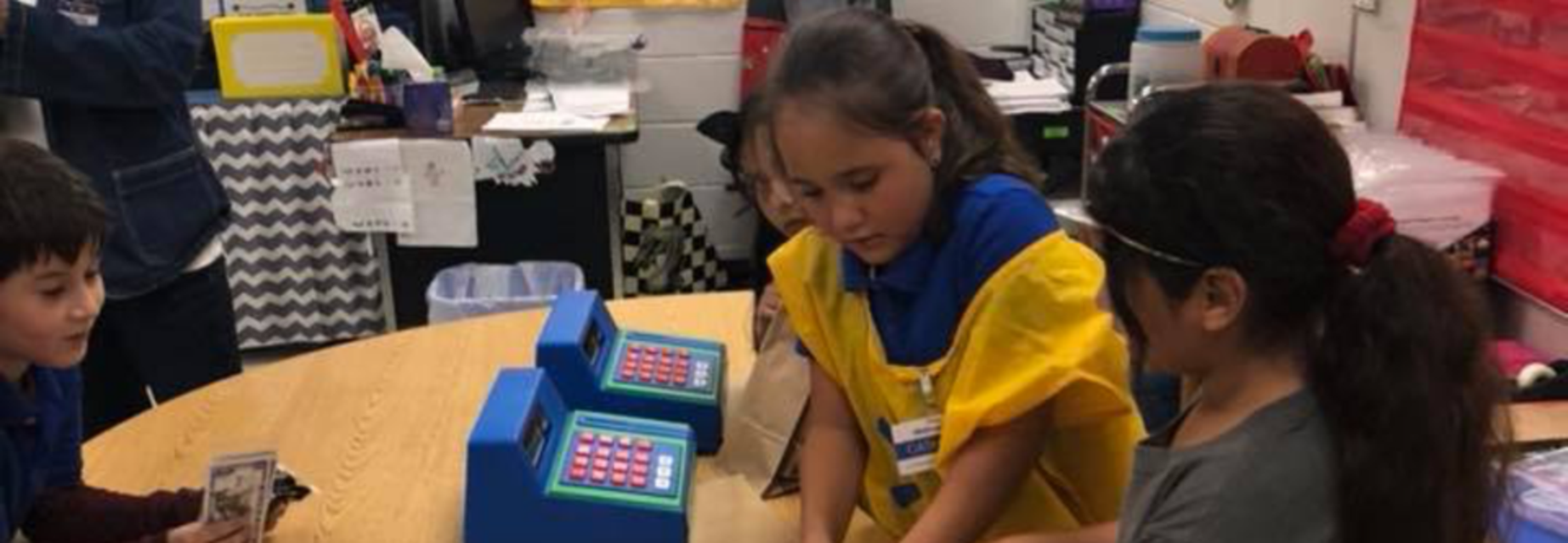 students working a cash register