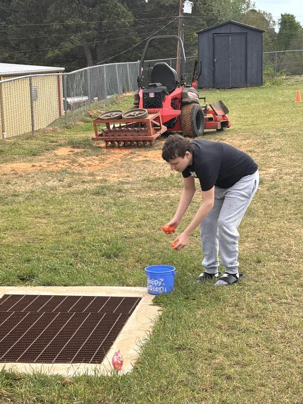 Life Skills kids hunting Easter eggs.