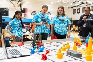Students react at the robotics competition