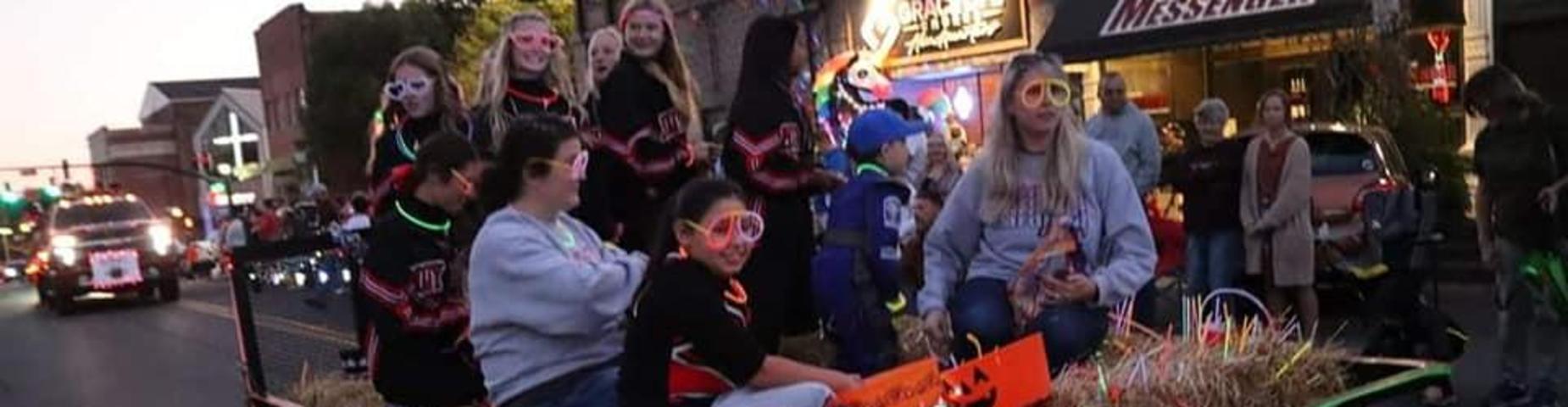 MHS Cheerleaders participated in the Glowing Graves Parade. Such a fun night!