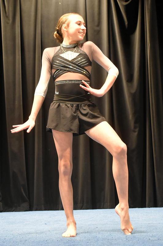 a  girl dancer striking a pose