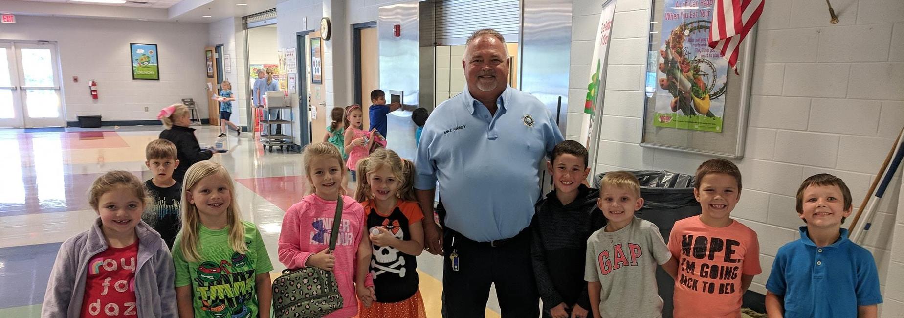 Officer Rainey and Elementary Students