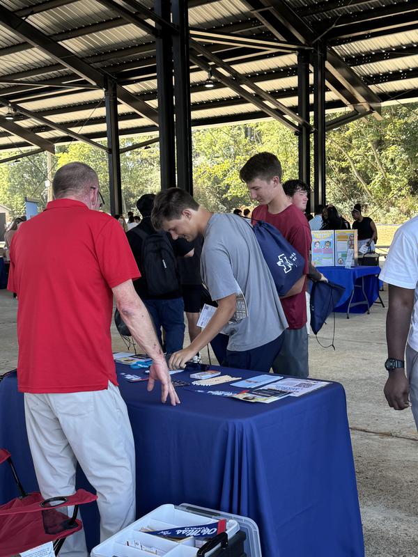 PHS students at the career fair, meeting with different people at tables