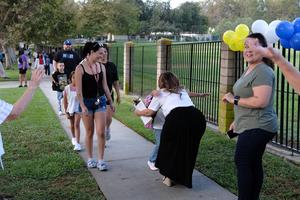 Principal greets families