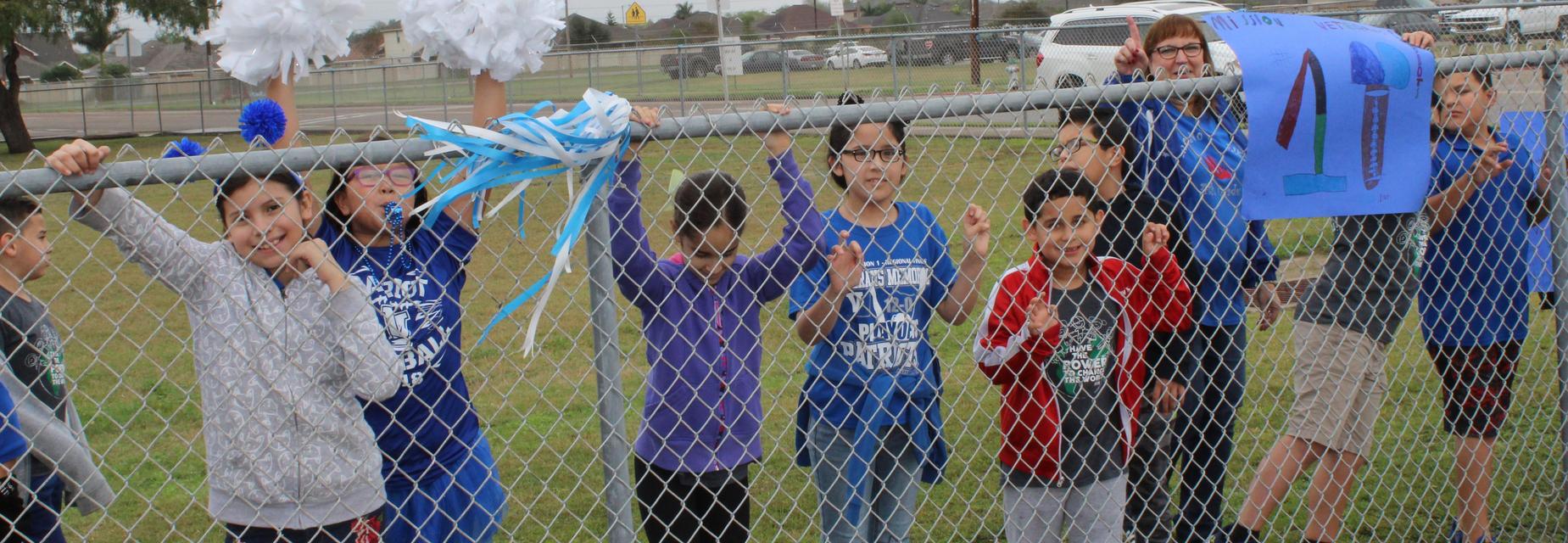 students and staff cheering