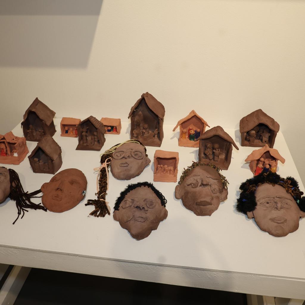 Clay faces and houses
