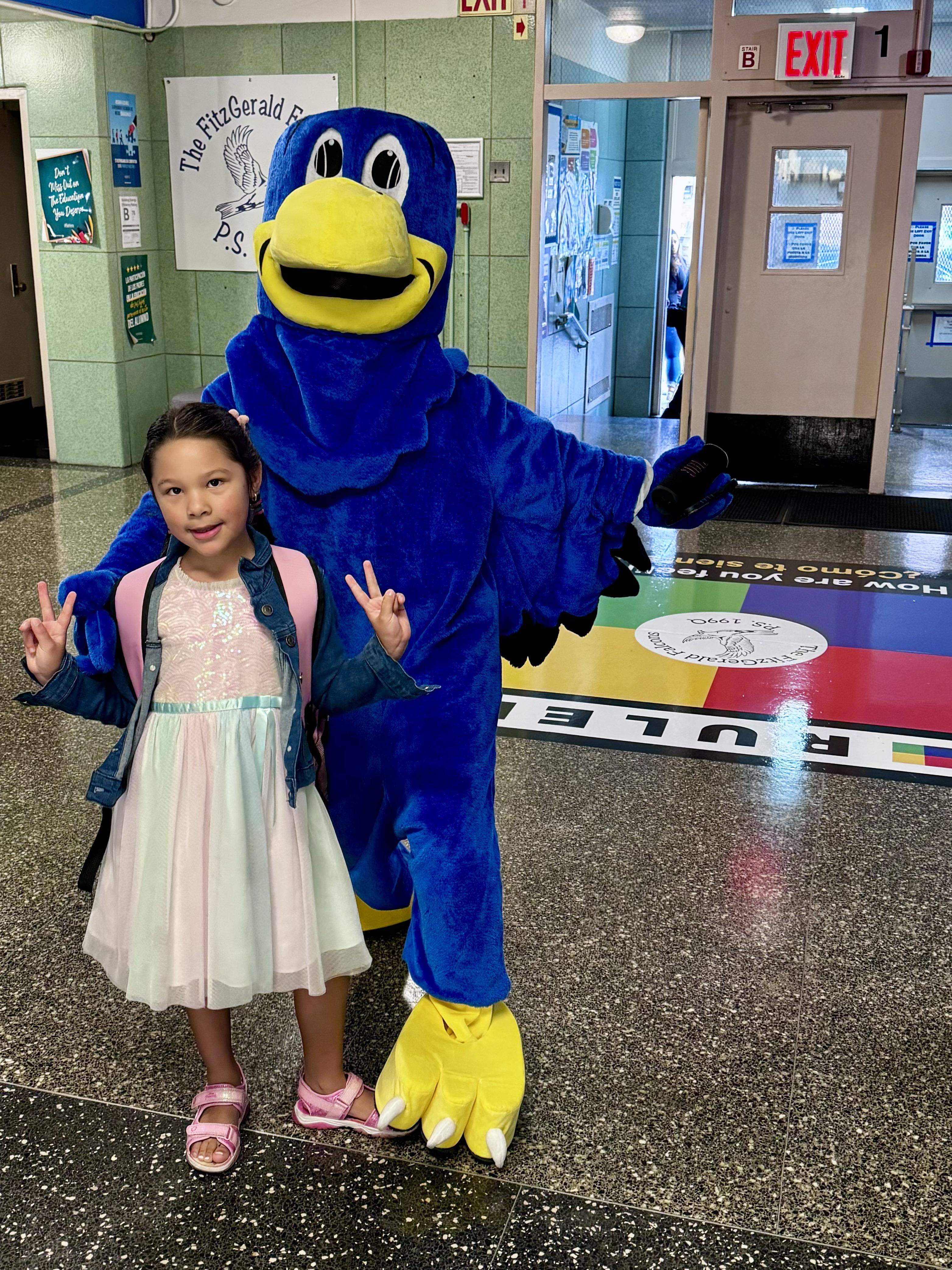 Falcon mascot with student