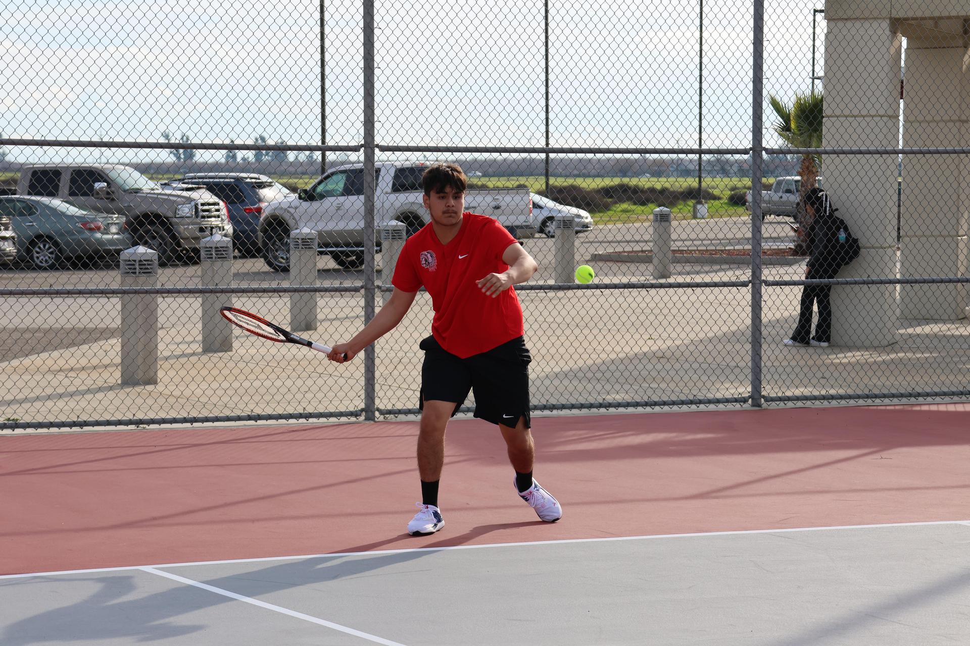CUHS Boys playing tennis against coalinga