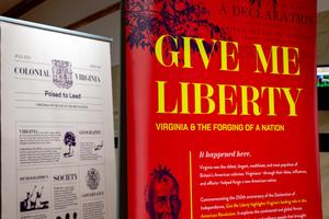 The opening panel of the "Give Me Liberty" exhibition stands at the front door.