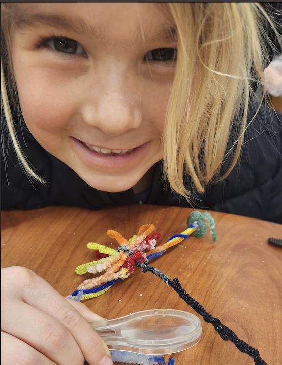 Student with magnifying glass
