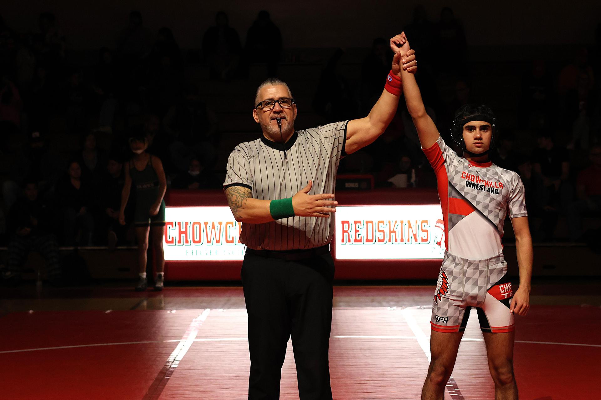 Wrestling winners with hands up 82