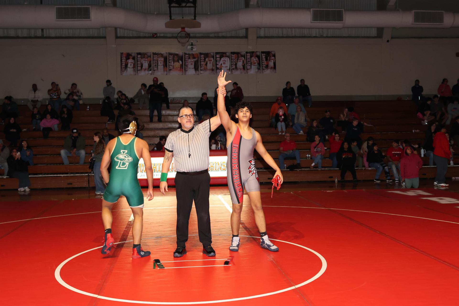 Wrestling winners with hands up 129
