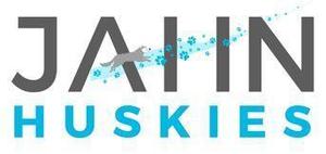 Husky running through the Jahn logo