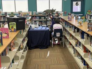 An eye doctor tests a student's eyes