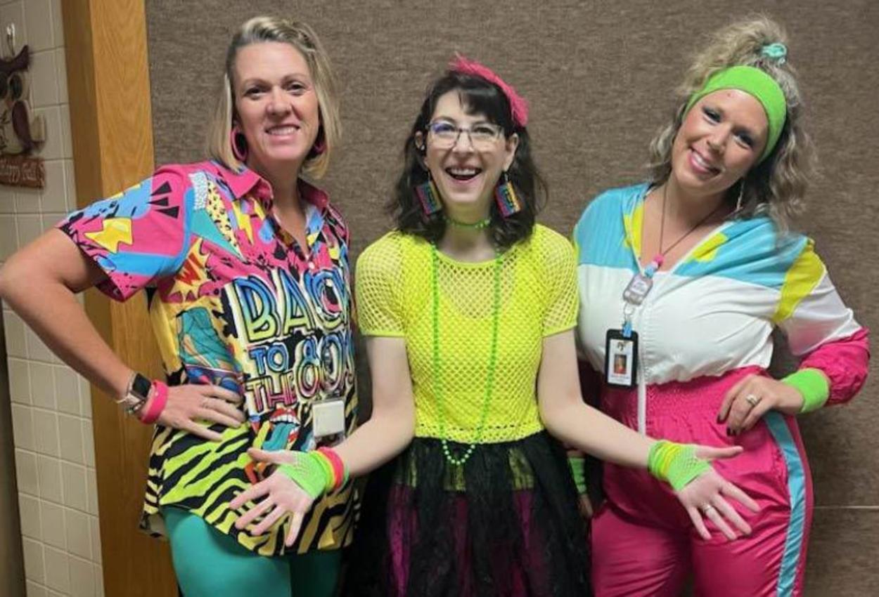 Penn Middle staff Mrs. Lisa DeWitt, Mrs. Nancy Beck, and Mrs. Brooke Hinzman flash back to the 80’s wearing neon during spirit week