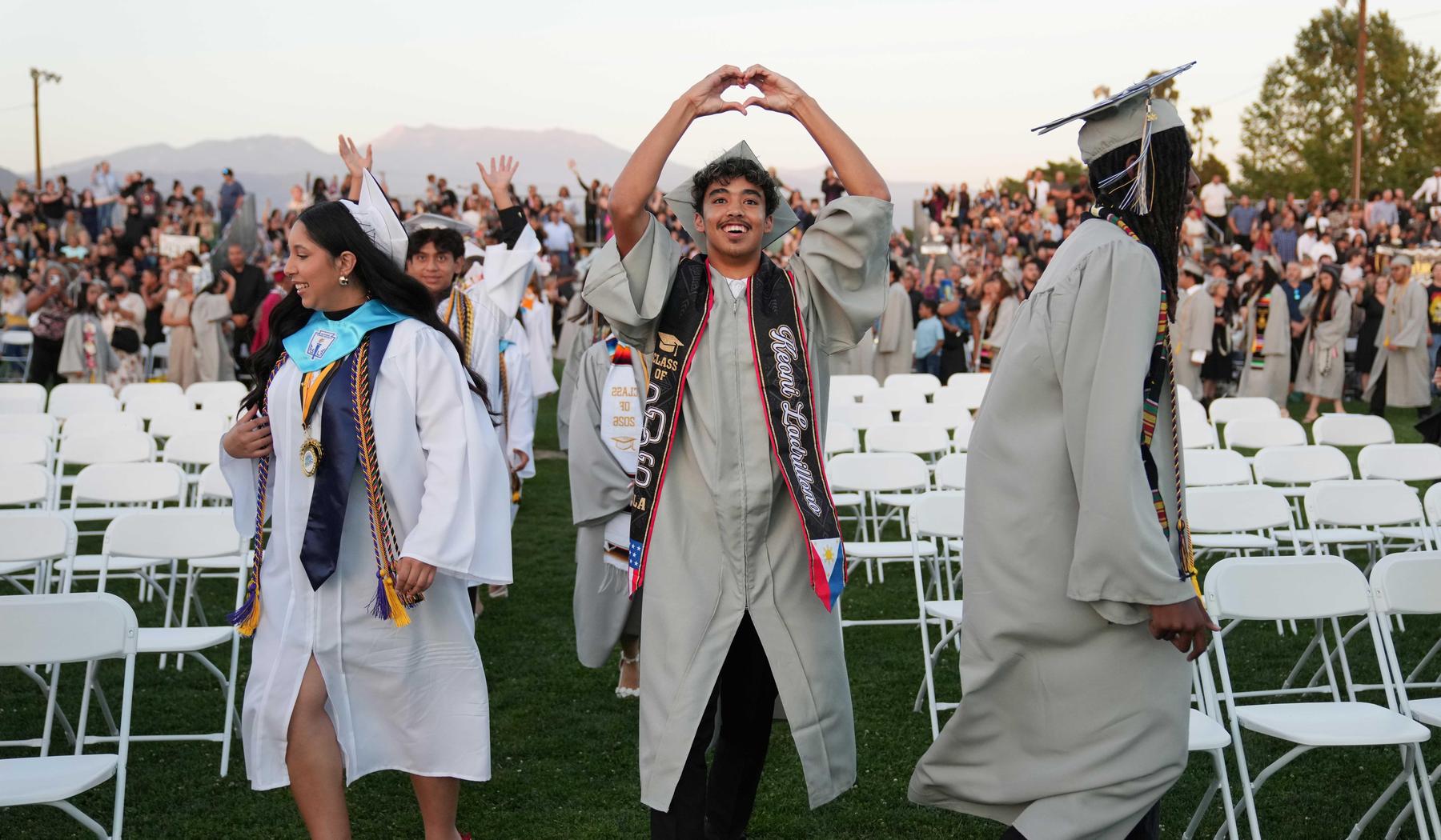 SJLA Grad with hands forming a heart