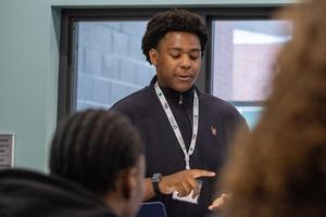 A student speaks in a group