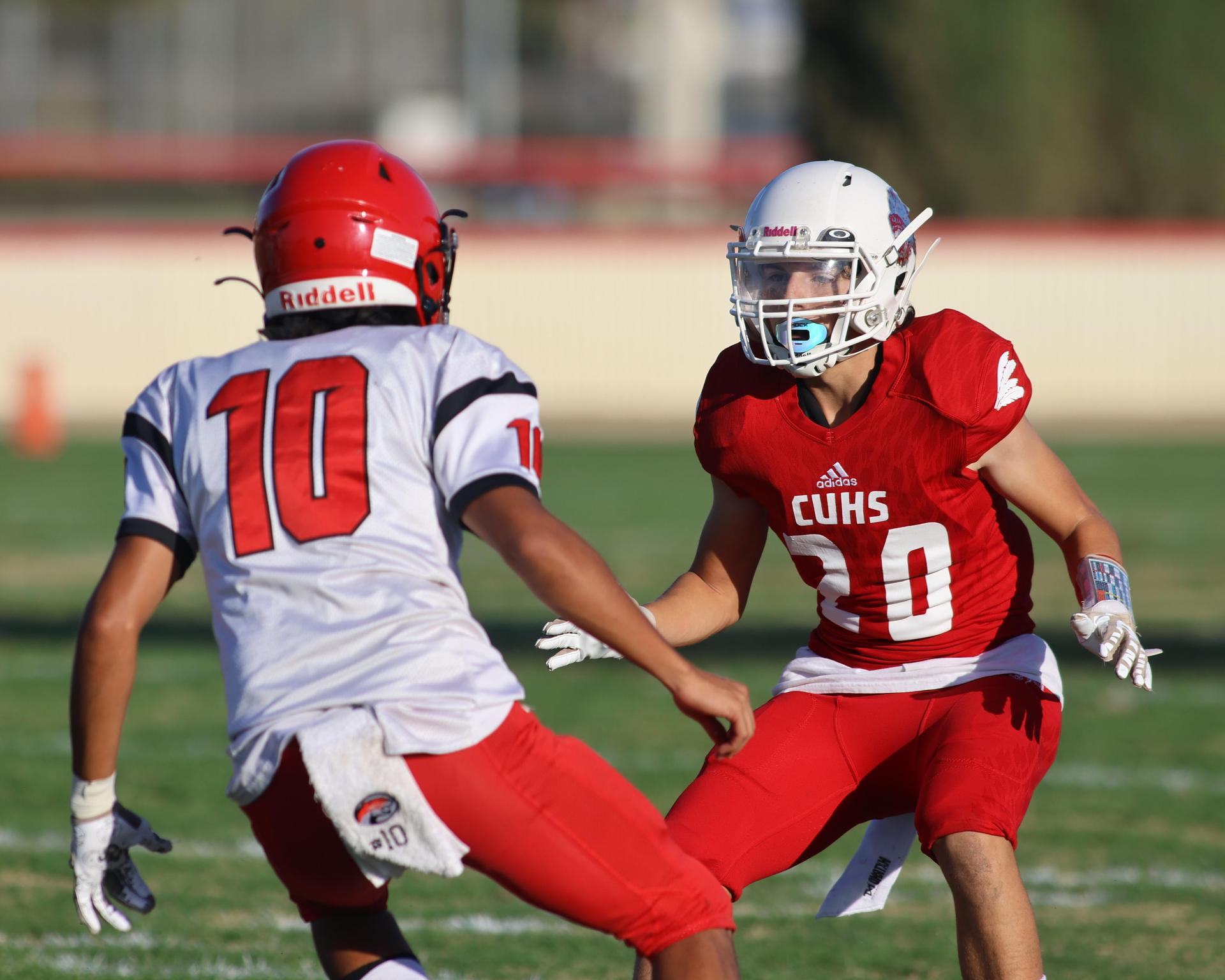 junior varsity football players in action against Fowler