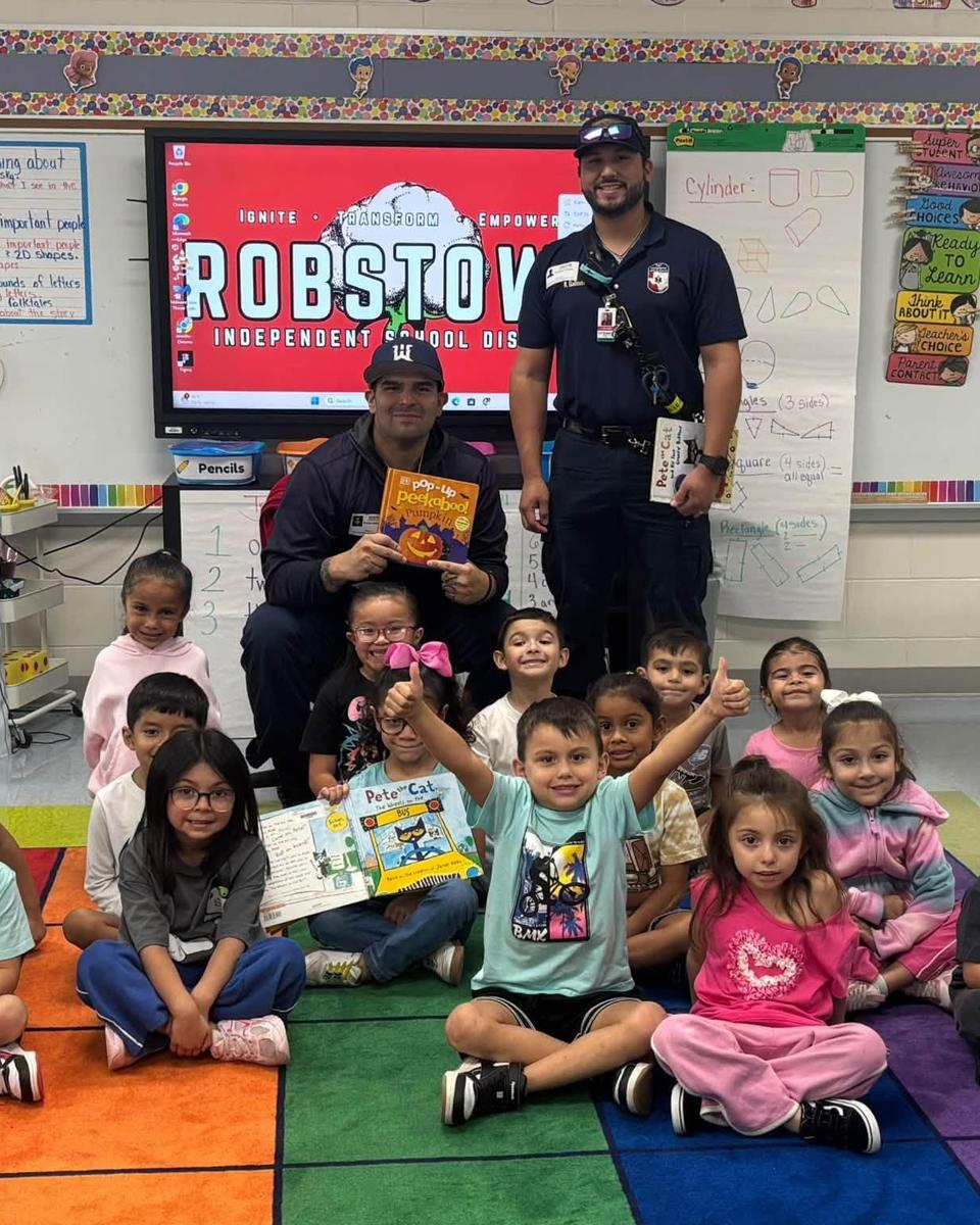 EMTs visiting Ms. Flores' kindergarten class
