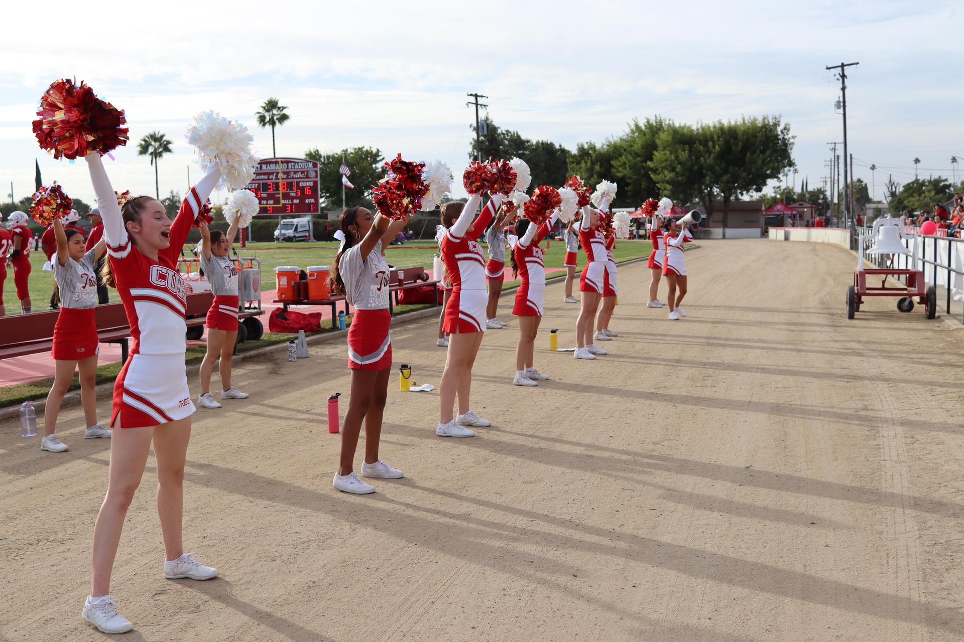 junior varsity cheerleaders in action at the Riverdale game