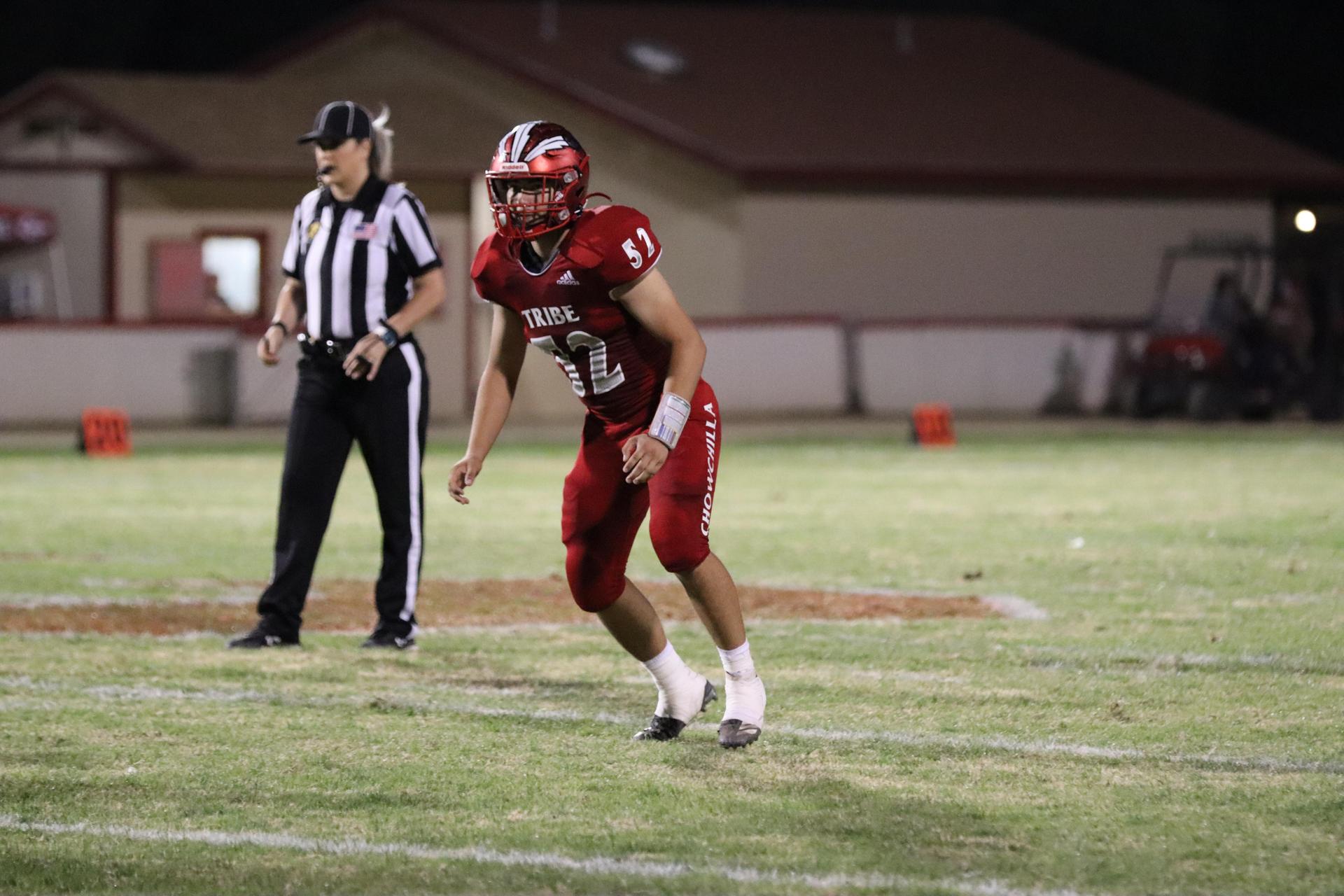 varsity football players in action against Riverdale