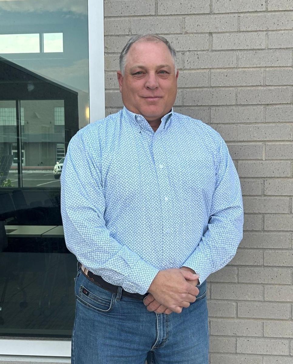 James Welch posing in front of PV district building