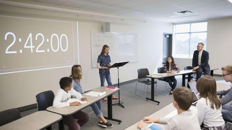 German Debate Club with Timer on the Wall