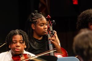 The 8th grade orchestra performs