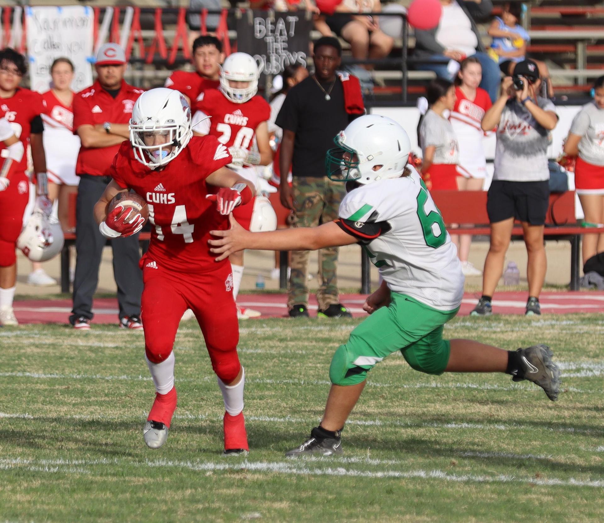  junior varsity football players in action against riverdale