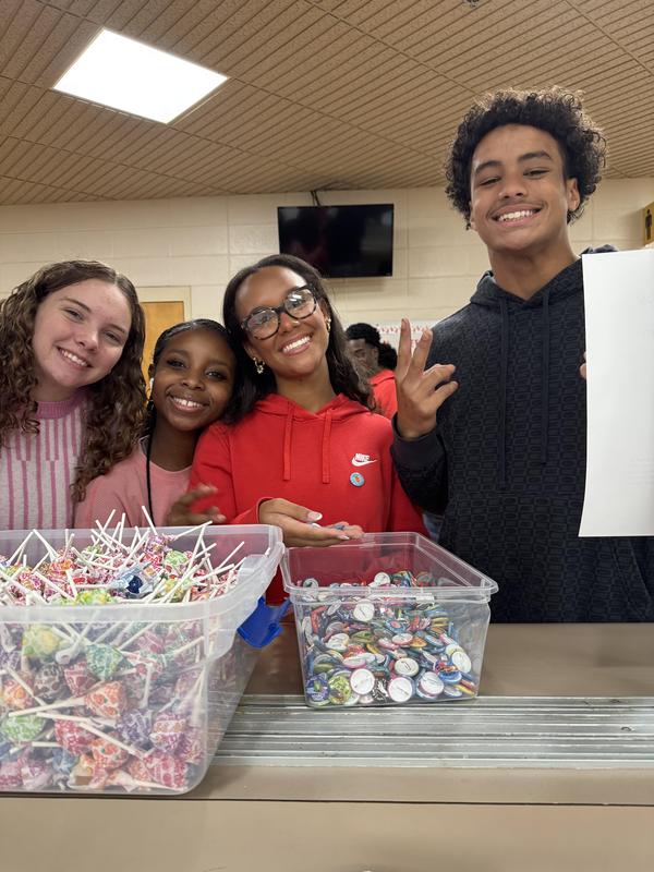 Four students getting dumdums