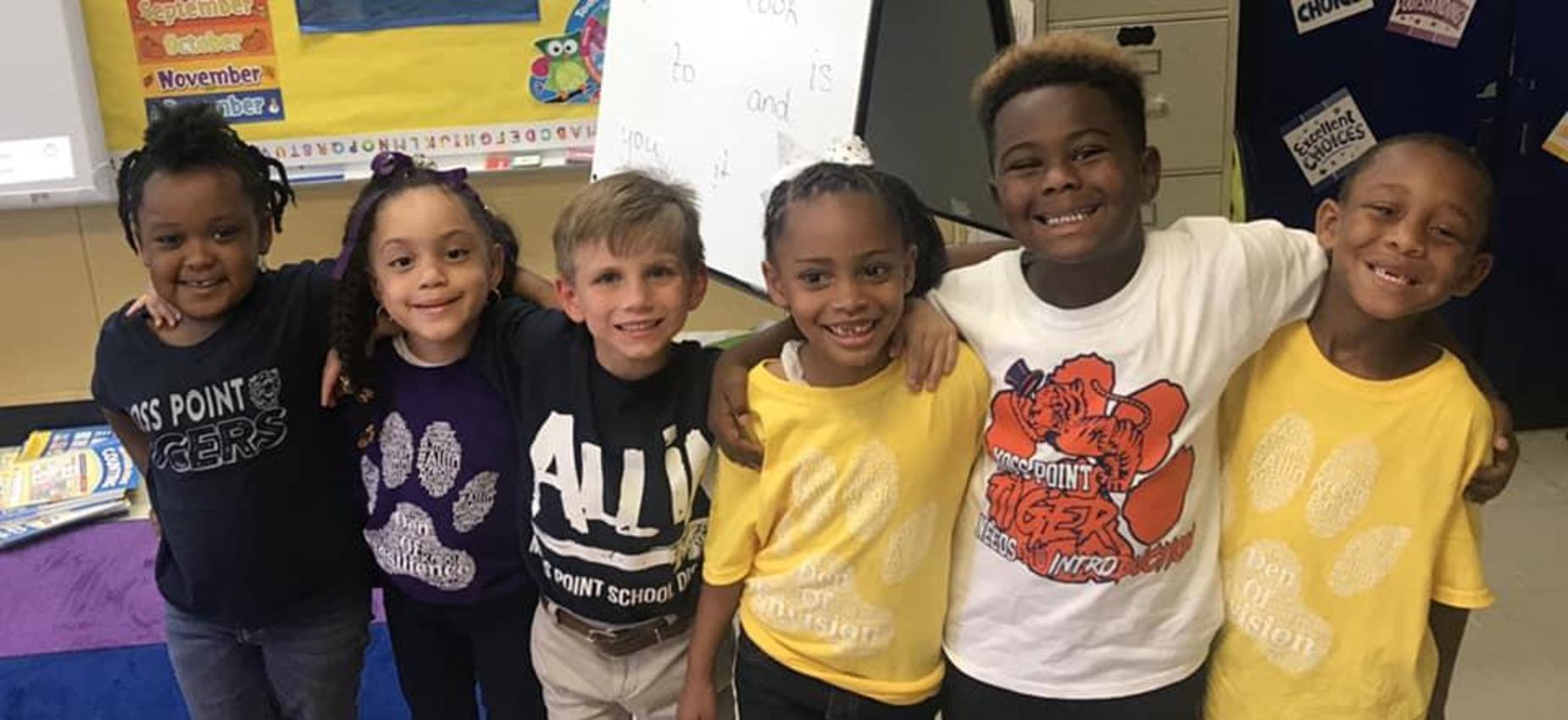 kids lined up smiling