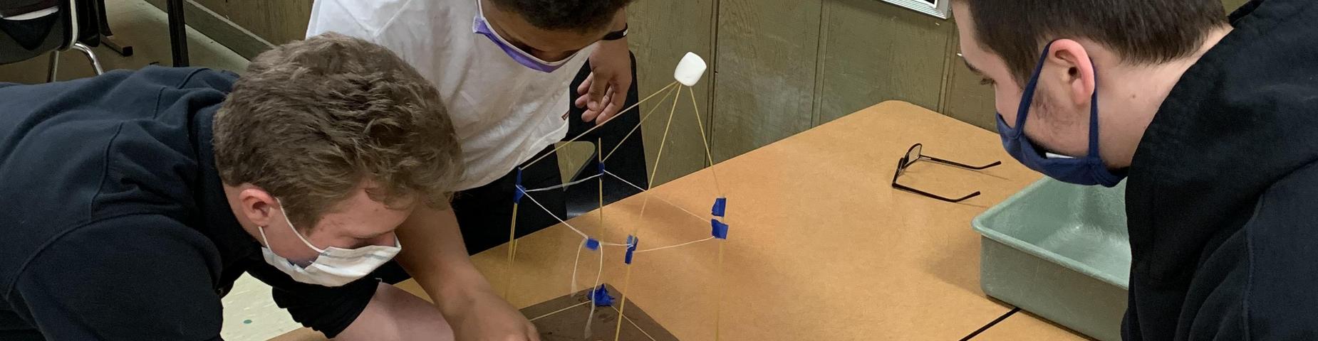 Mrs. Guhy's Physic Class working on their STEM project.