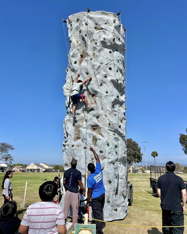 Child climbing rock wall