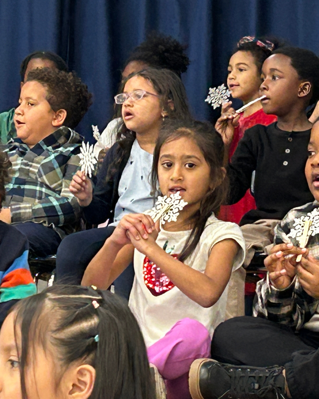 Children at IB Sharing assembly