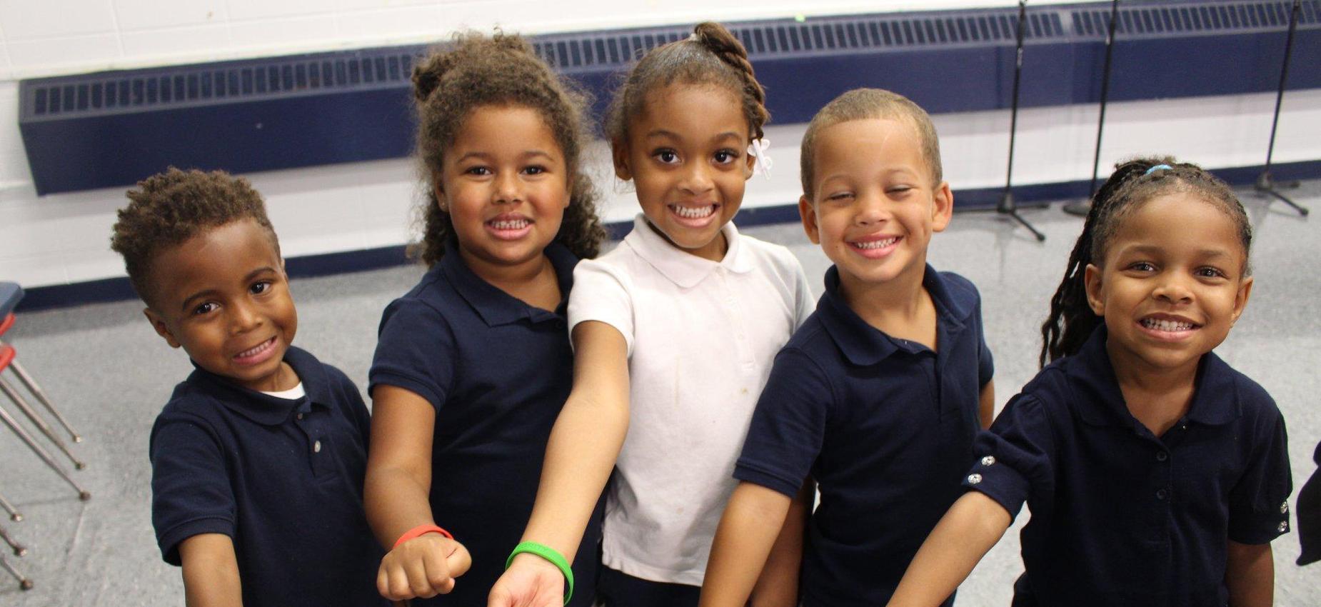 kids smiling at camera