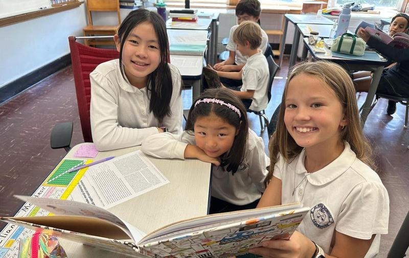 Picture(s) of the week: Grade 6 and Grade 1 Reading Buddies spending time together reading books!