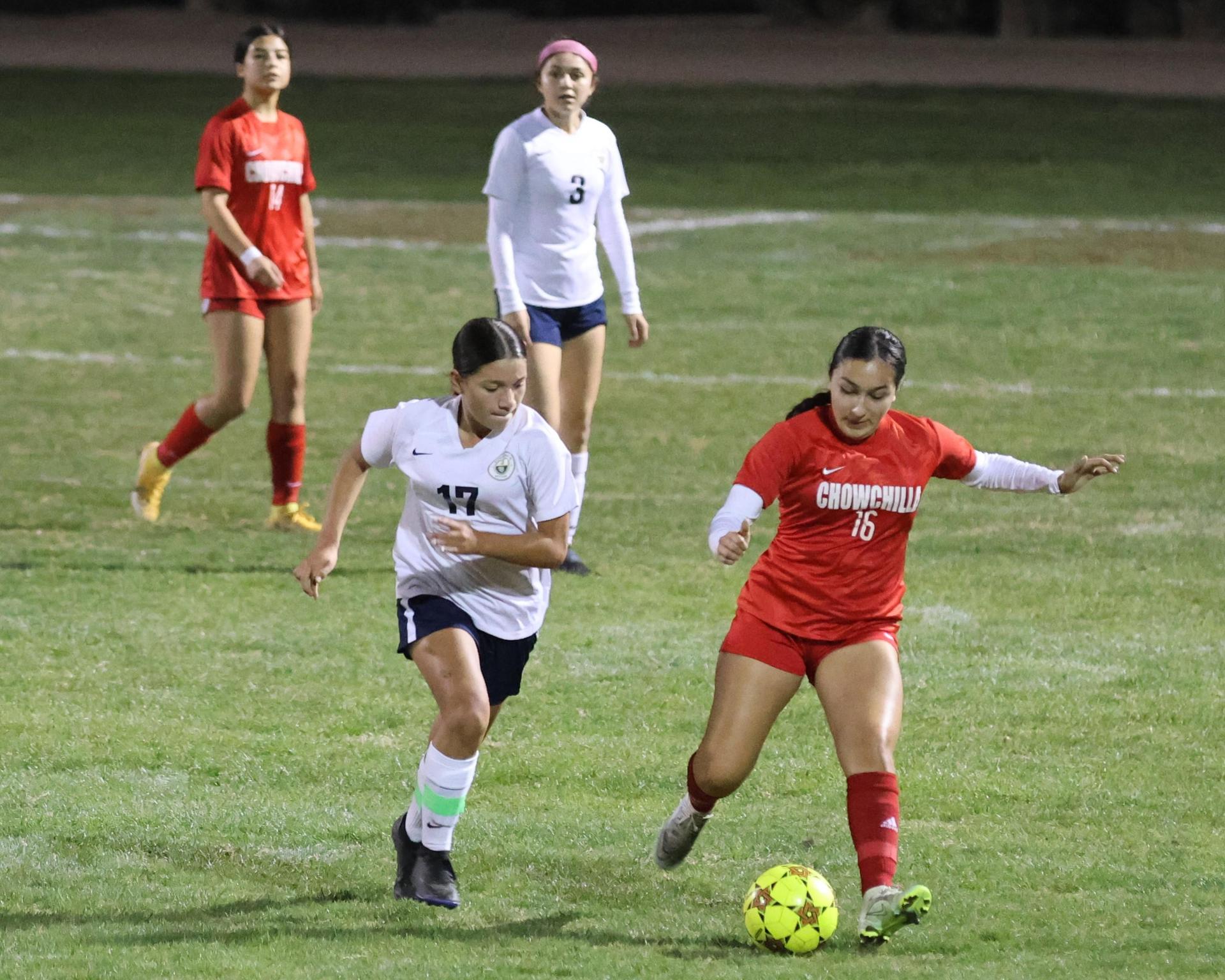 Varsity girls playing soccer against sunnyside