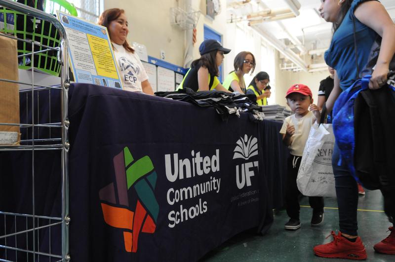 community fair table and students