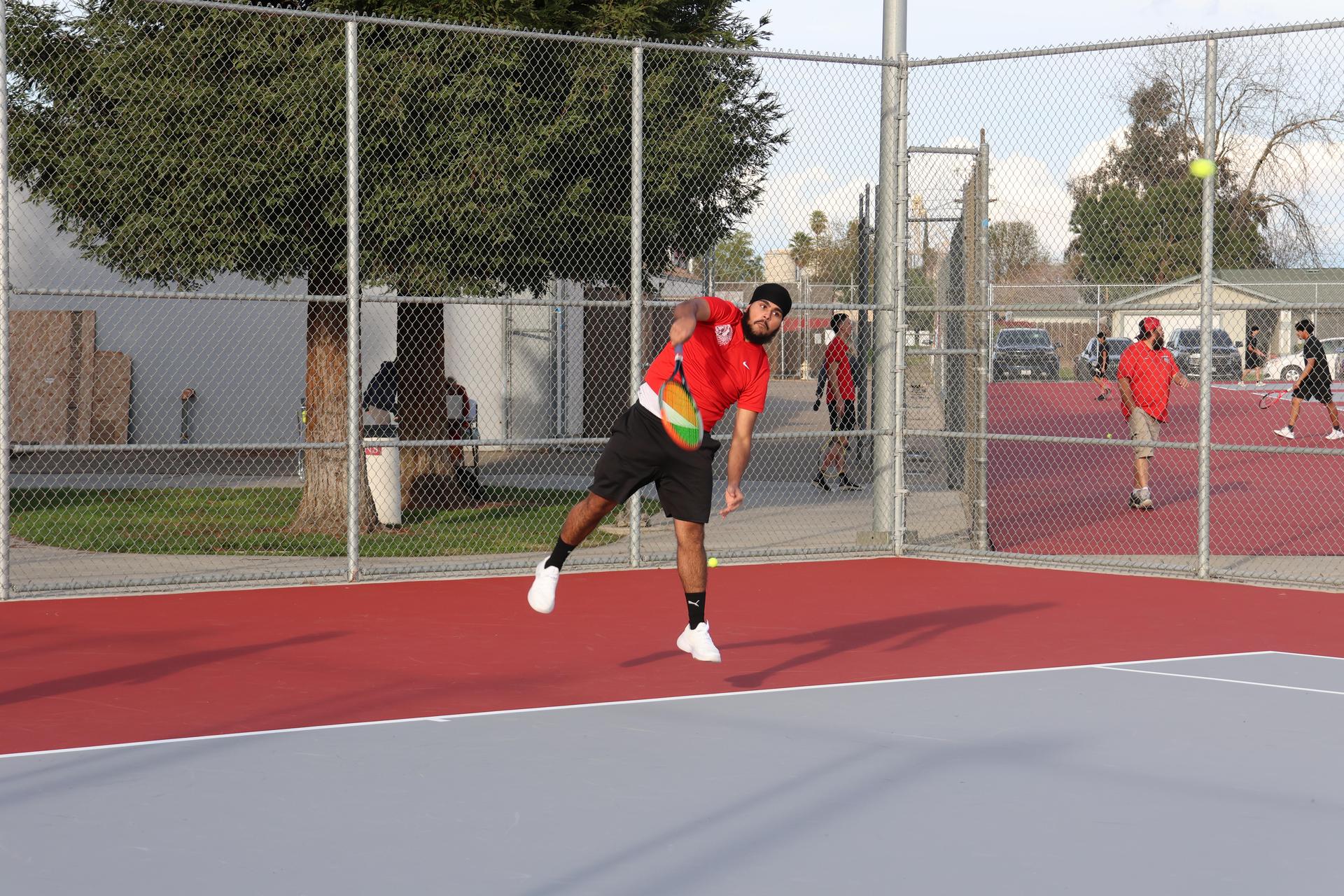 CUHS Boys playing tennis against coalinga