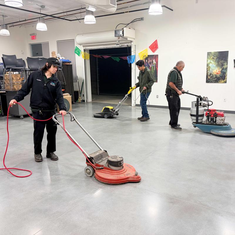 Custodians polishing floors