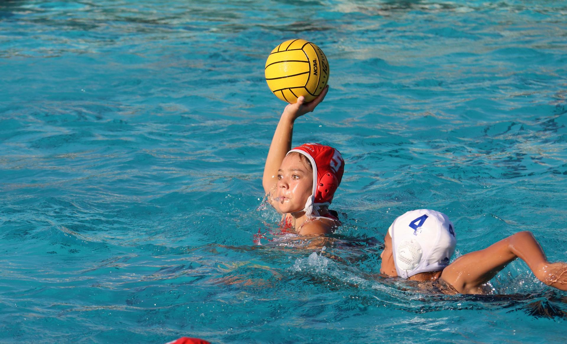 girls playing water polo against Sanger West