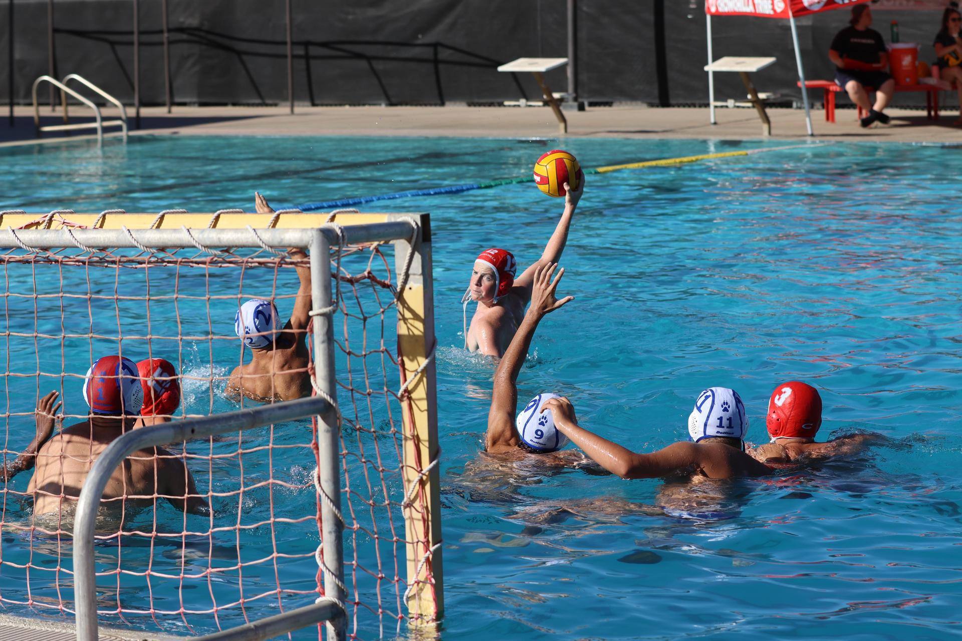boys playing water polo against Madera