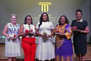 School level teachers of the year pose for a photo with their awards