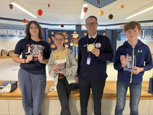 three middle schools students with adult