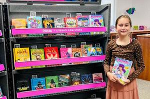 Book Fair display with student