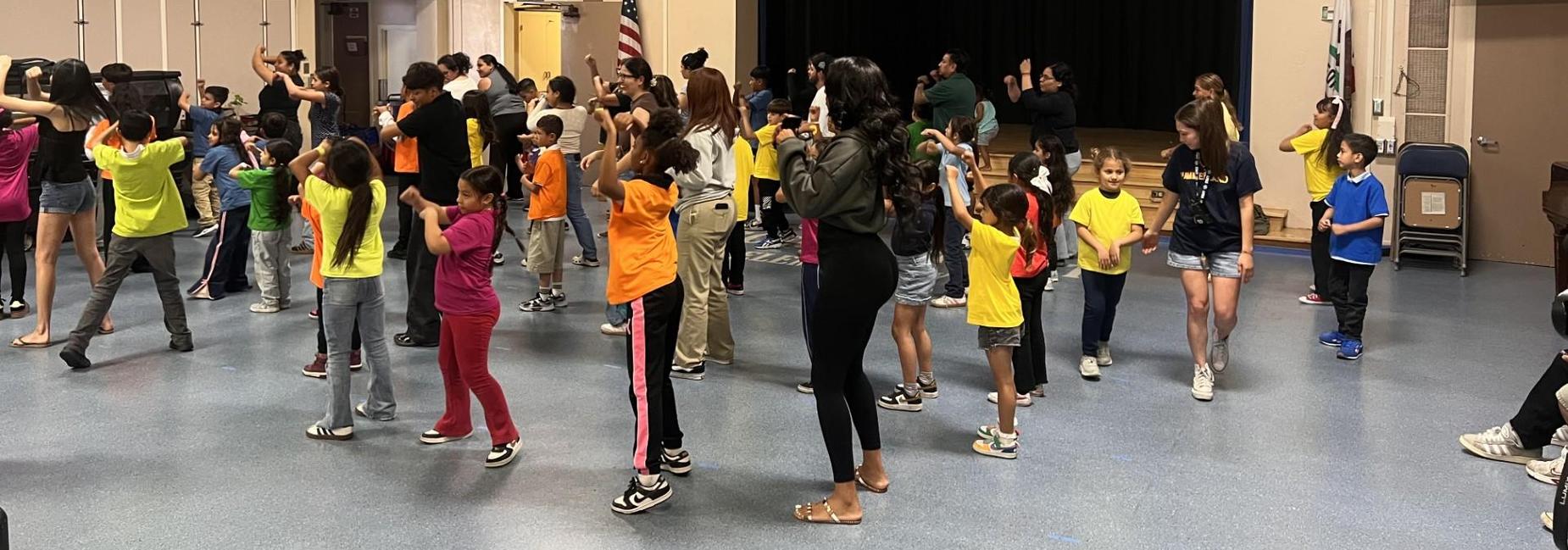 students dancing with parents during afterschool dance program