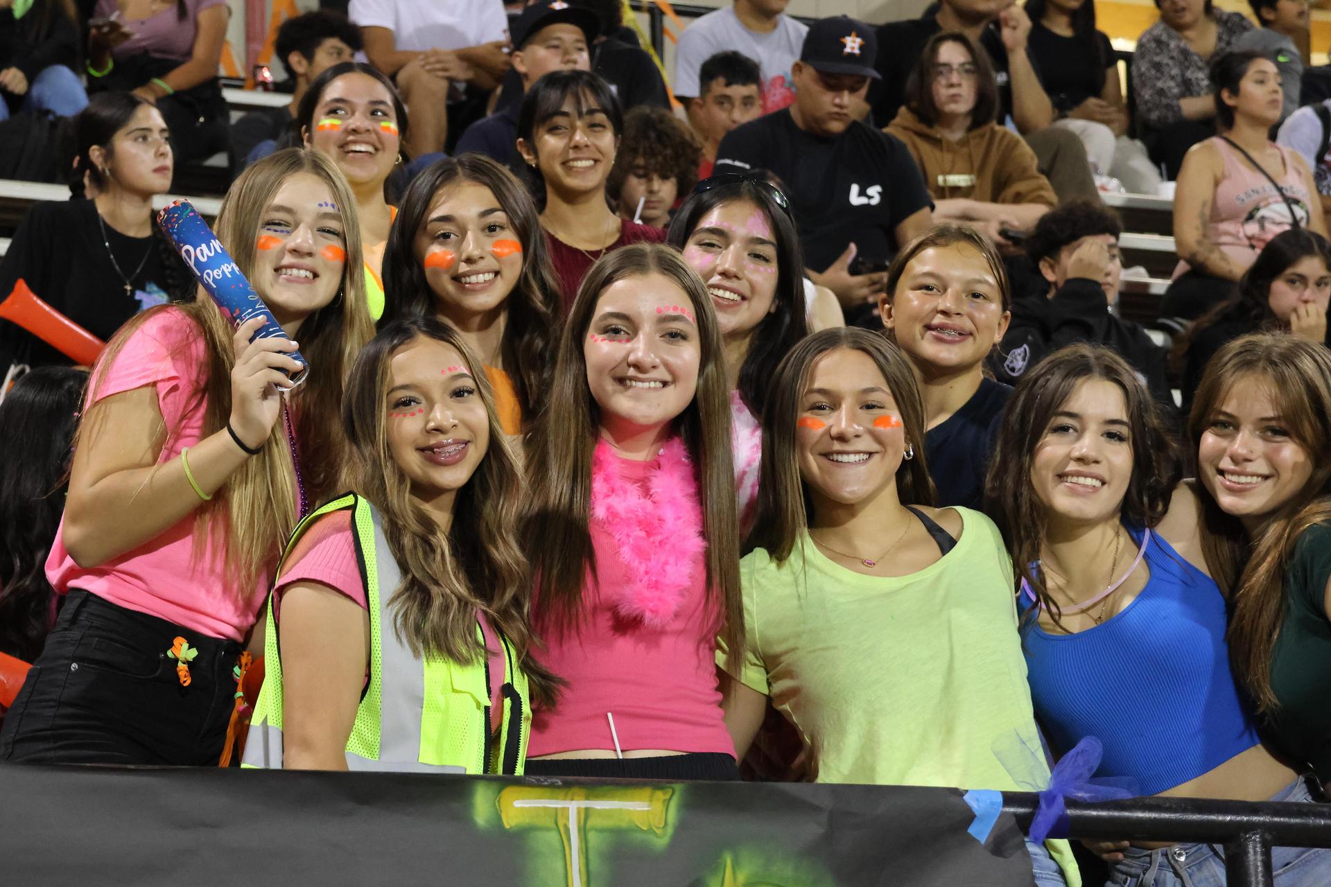 Students and community members enjoying the football game.