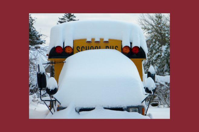snow buried over bus