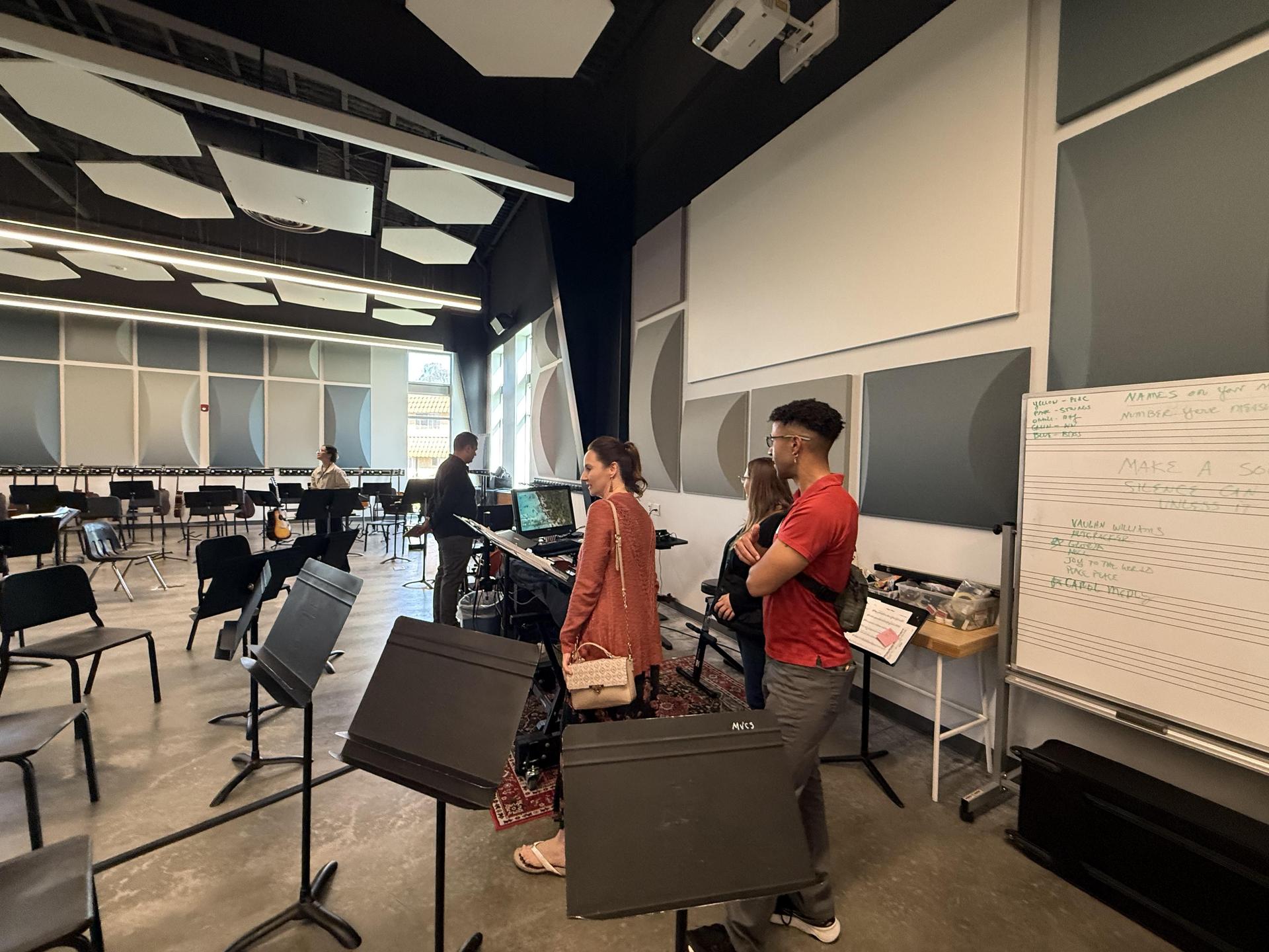 Music teachers in an auditorium.