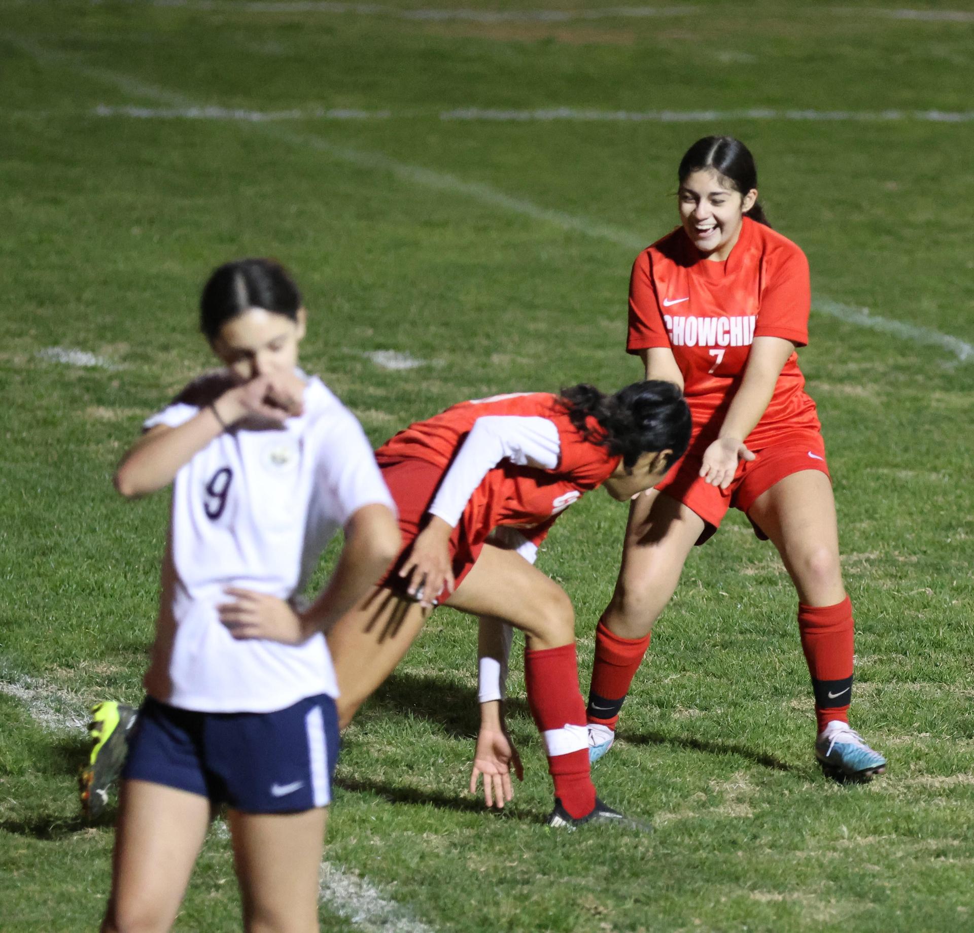 Varsity girls playing soccer against sunnyside
